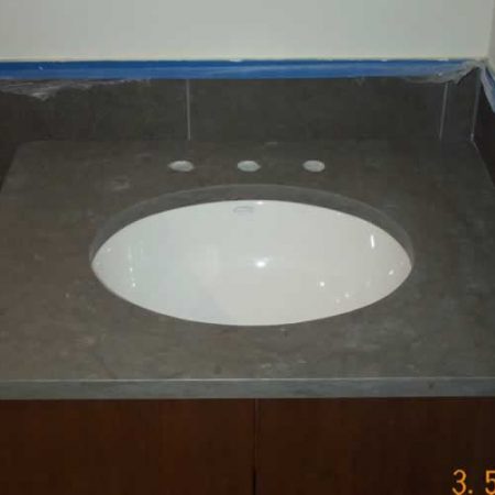 Oval Sink Installed on Limestone Vanity